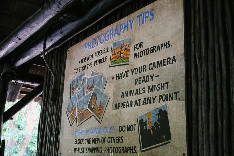 a sign that shares photography tips in the queue of Kilimanjaro Safaris at Disney's Animal Kingdom