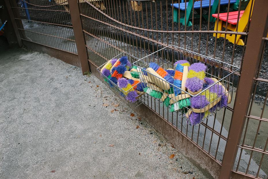 a bin with brushes for the animals at Affection Section area of Rafiki's Planet Watch 