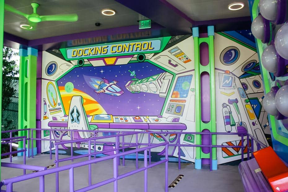 theming in the queue of Alien Swirling Saucers with a wall that says Docking Control 