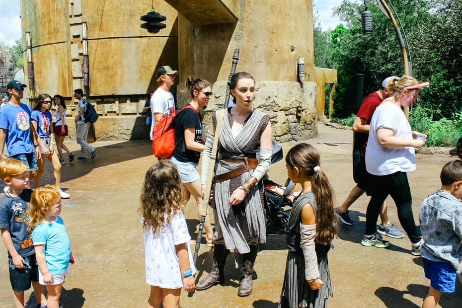 Rey talking with guests in Galaxy's Edge 