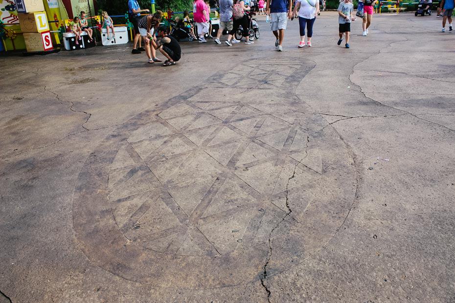 Andy's foot print is stamped in the concrete of Toy Story Land 