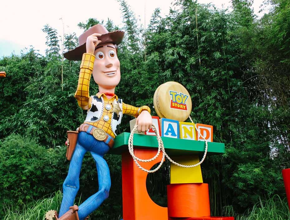 Woody tips his hat near the entrance to Toy Story Land at Walt Disney World 