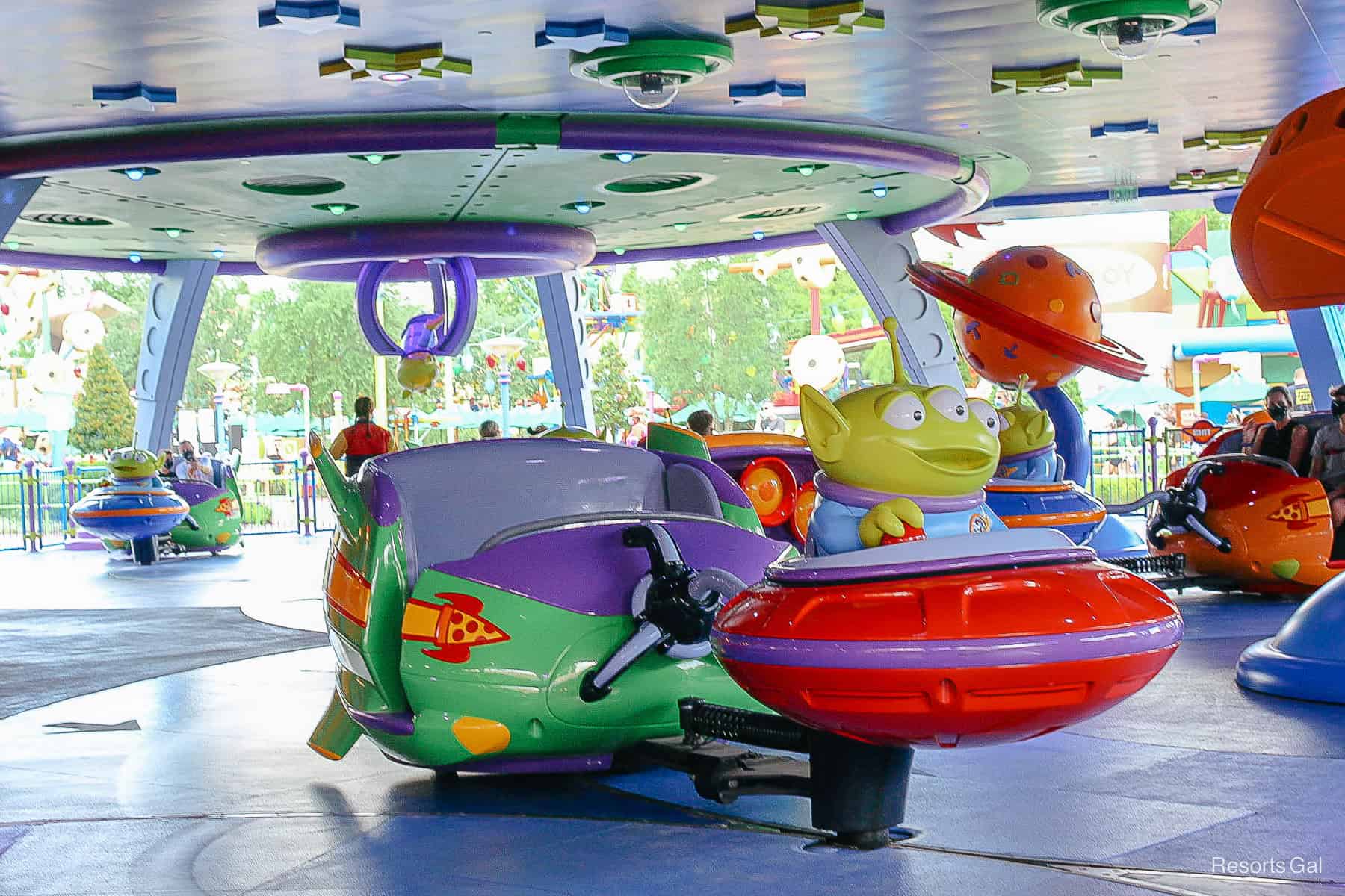 a cast member stands near the entrance of Toy Story Land
