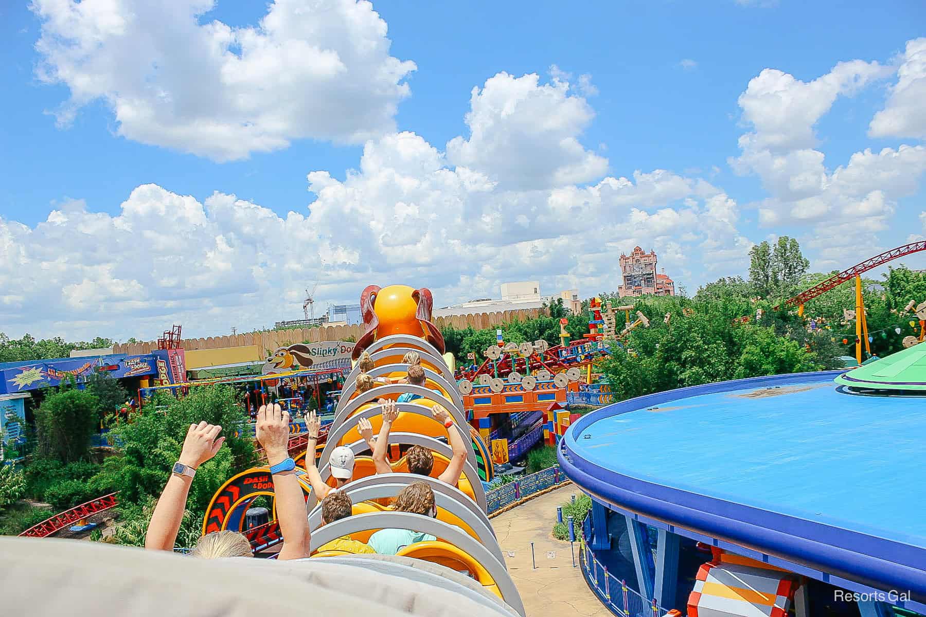 a view of the Tower of Terror over the fence of Andy's backyard on Slinky Dog Dash 