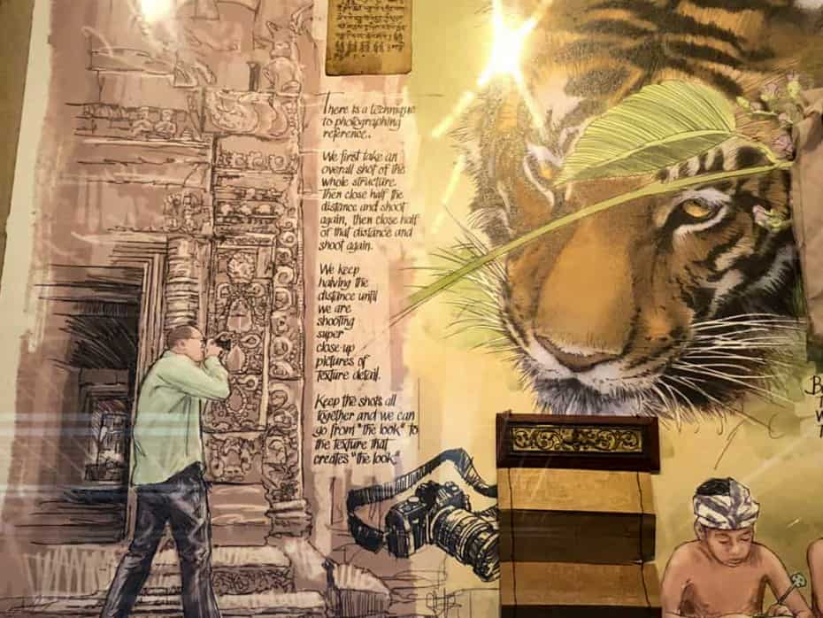 artwork showing a photographer taking pictures of a tiger 