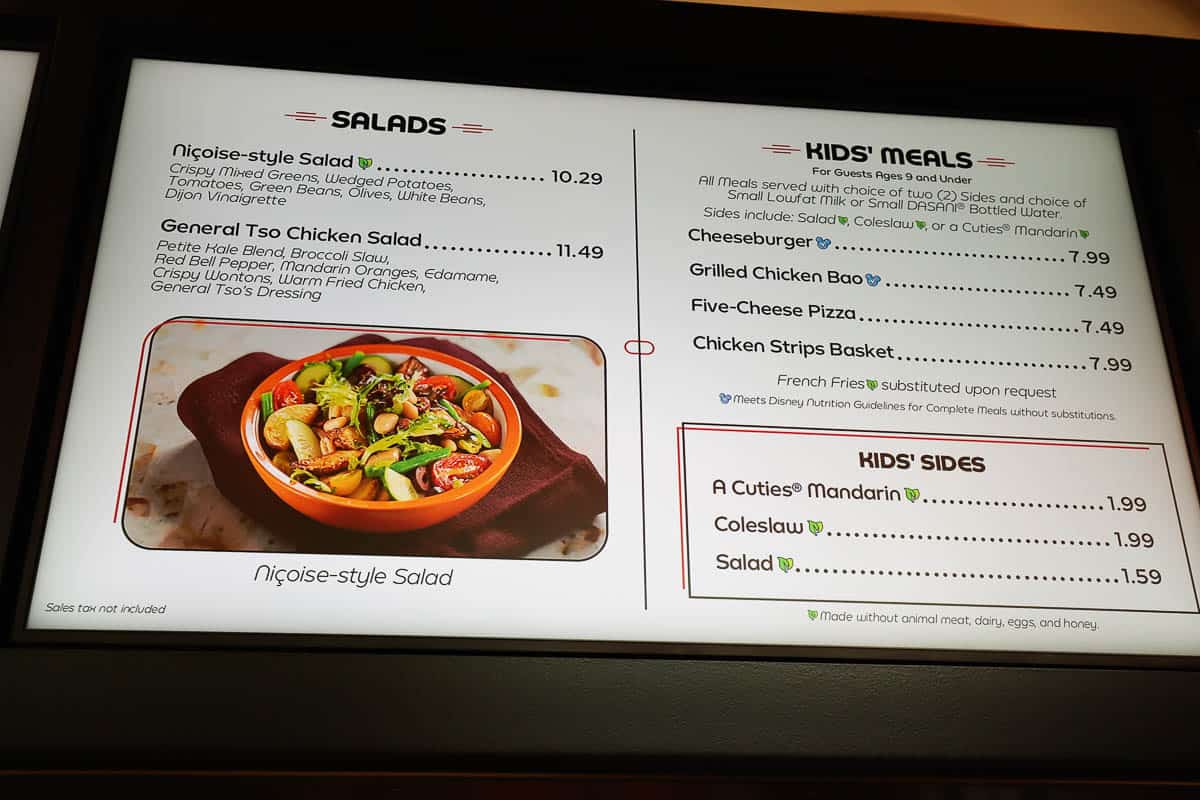 a menu board with salads and kids' meal 