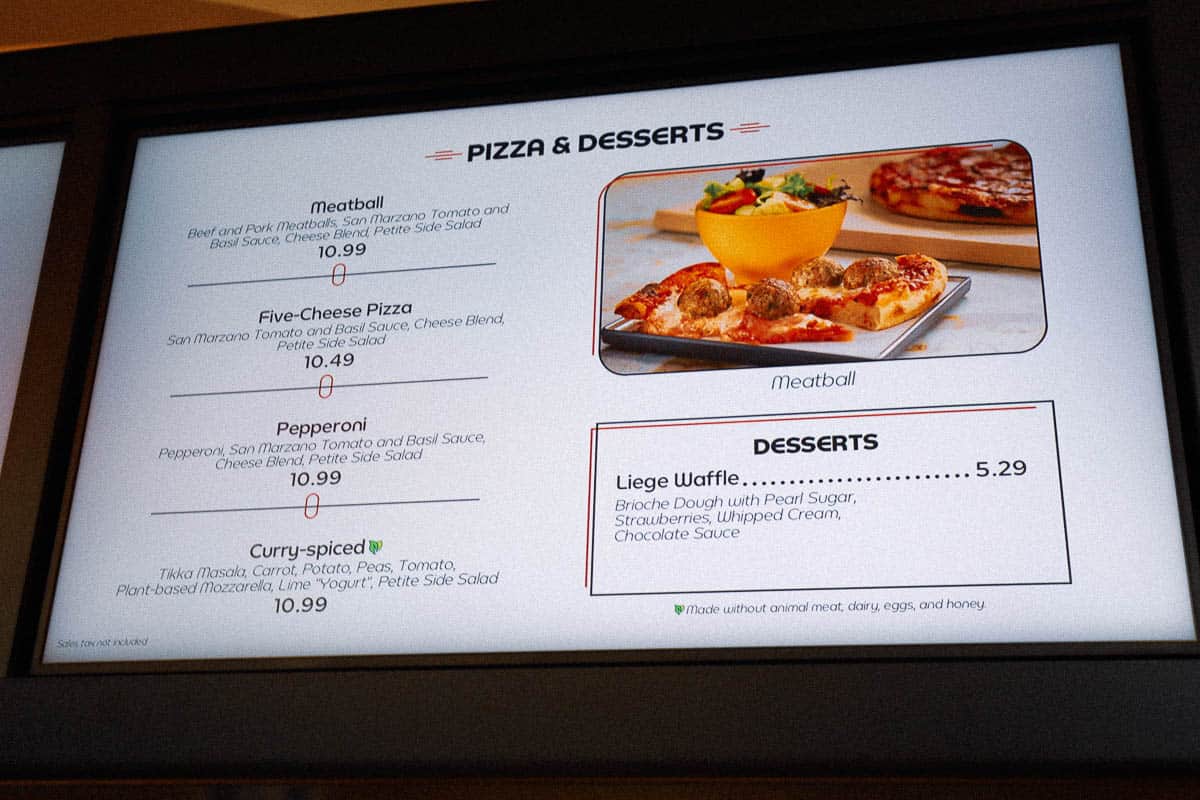 a menu board that shows the pizza options at Connections Eatery 