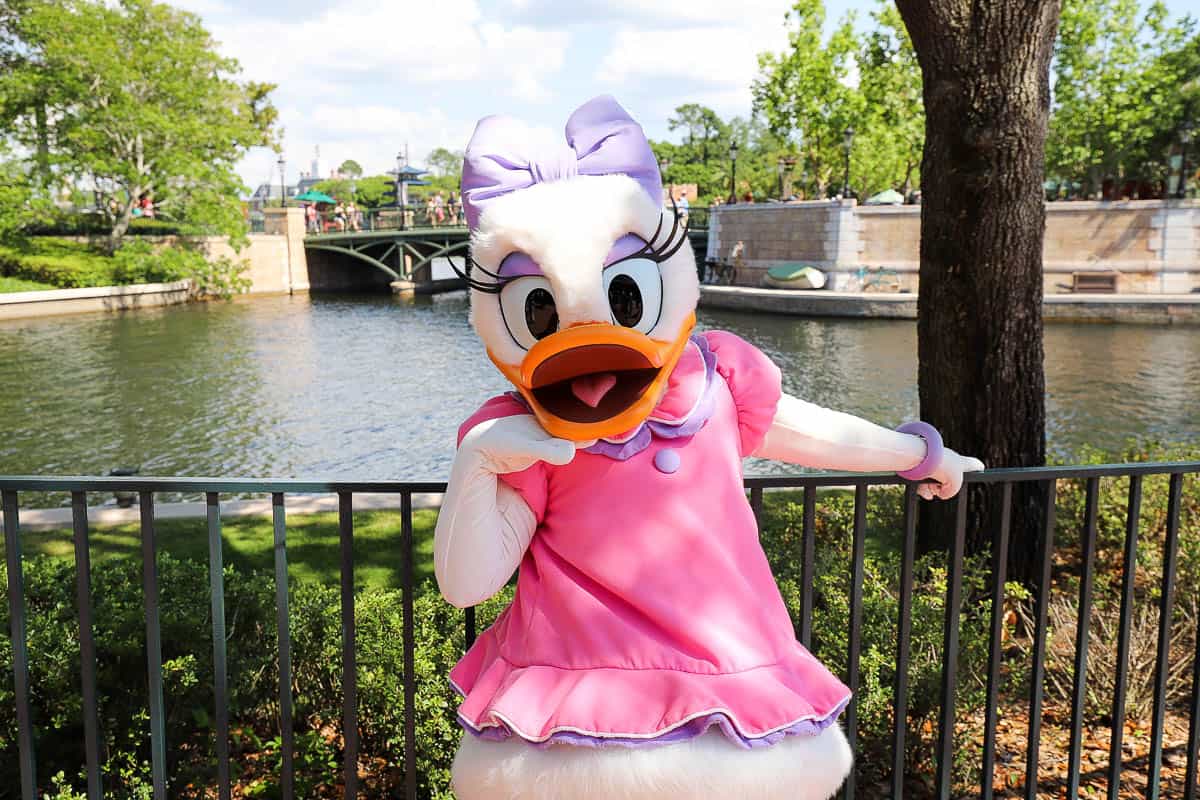 Daisy Duck with hand under chin pose. 