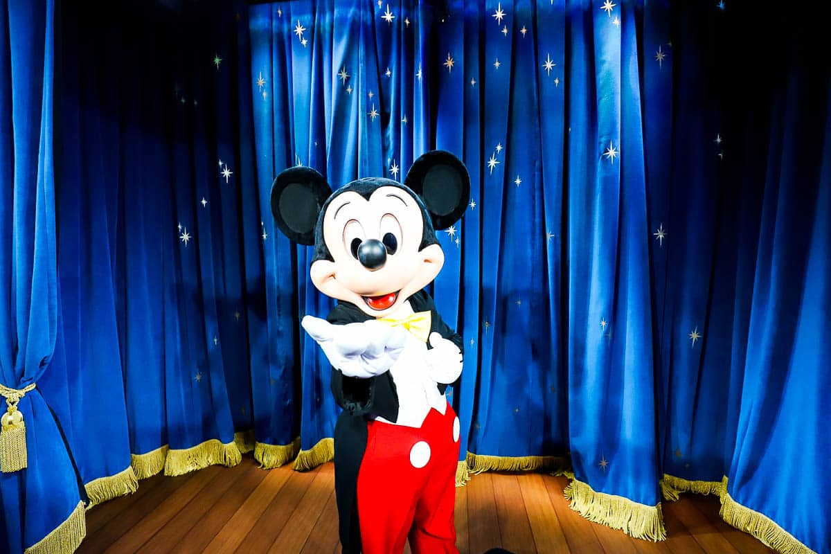 Mickey with his hand extended. 