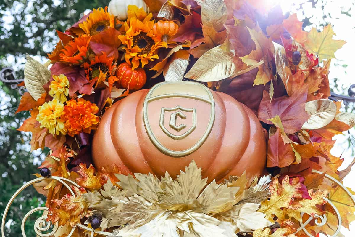 a wreath with Cinderella Coach themed pumpkins 