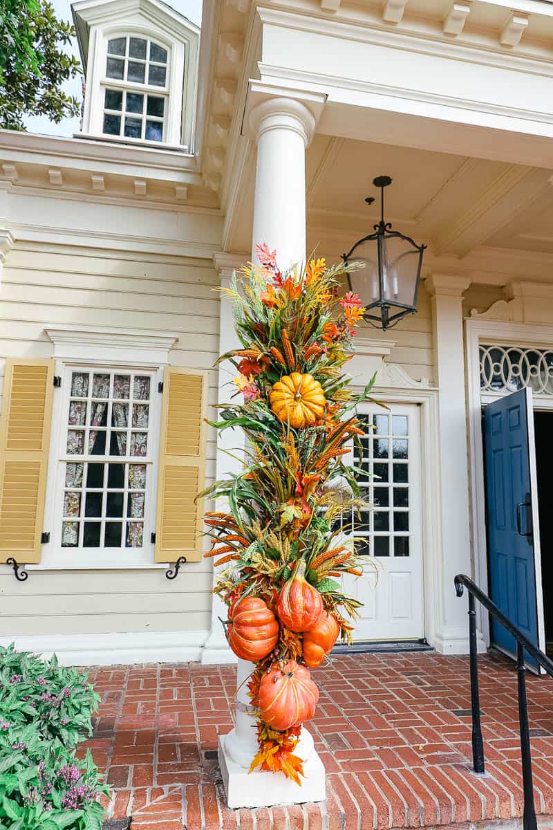 a display of pumpkins mixed with garland on the Liberty Tree Tavern 