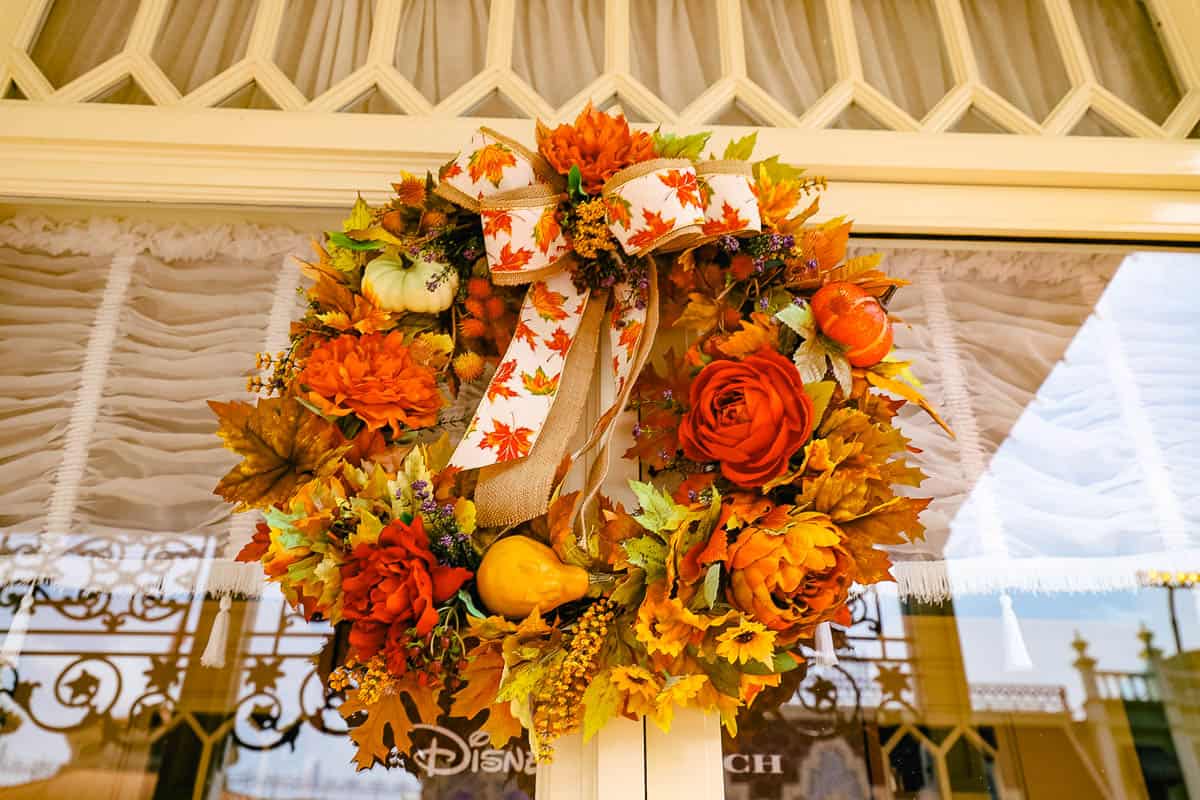 a wreath with pretty Fall ribbons and leaves for Halloween at Disney World 