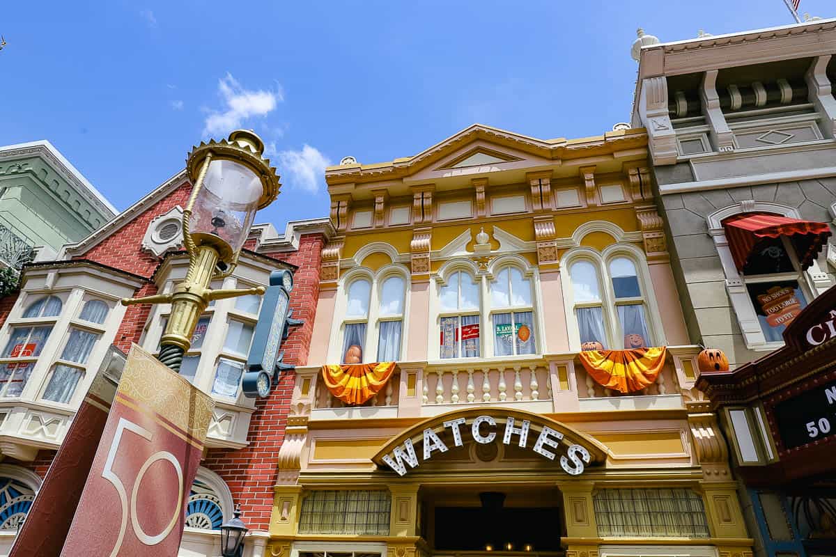 pumpkins places in the windows of Main Street USA at Magic Kingdom 