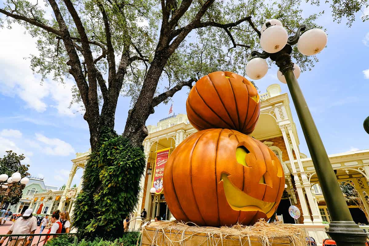 a crate with pumpkins stacked on top of it 