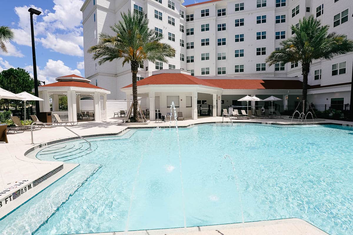 a view of the pool with a water feature 