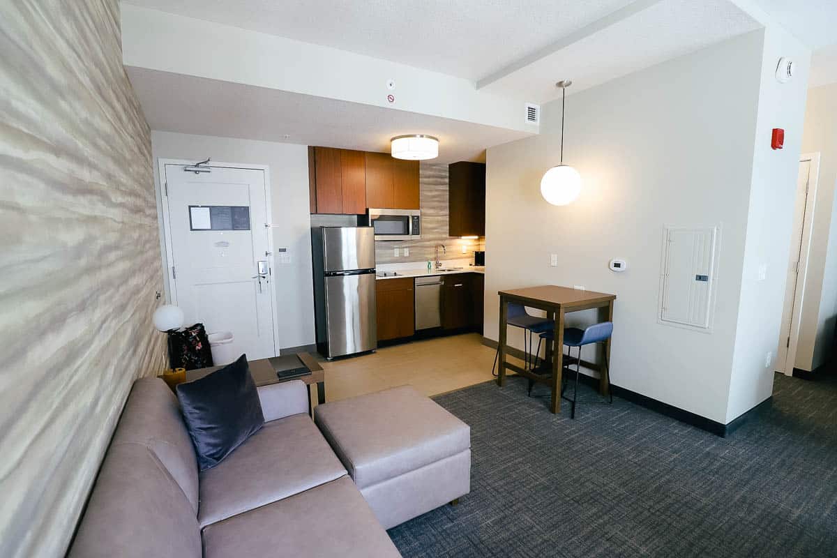 the living room to the kitchen of the studio at Residence Inn near Disney World 