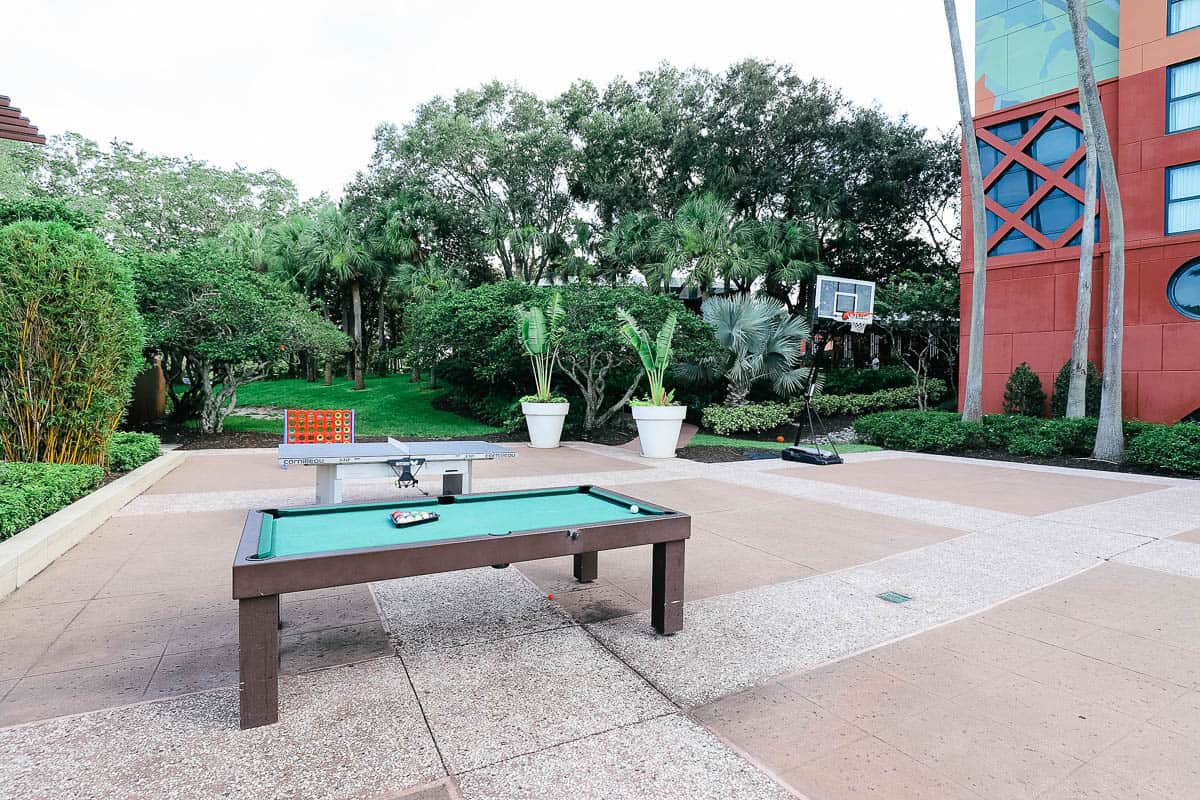 a pool table and ping pong table with basketball court for guests of the Swan and Dolphin 
