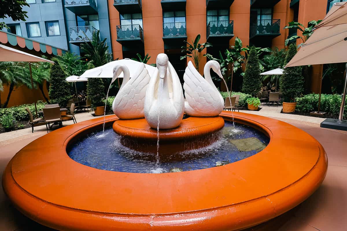 a fountain with Swan water features 