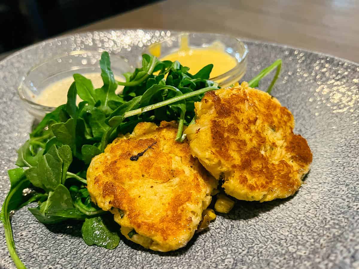 the crab cakes at Ale and Compass 