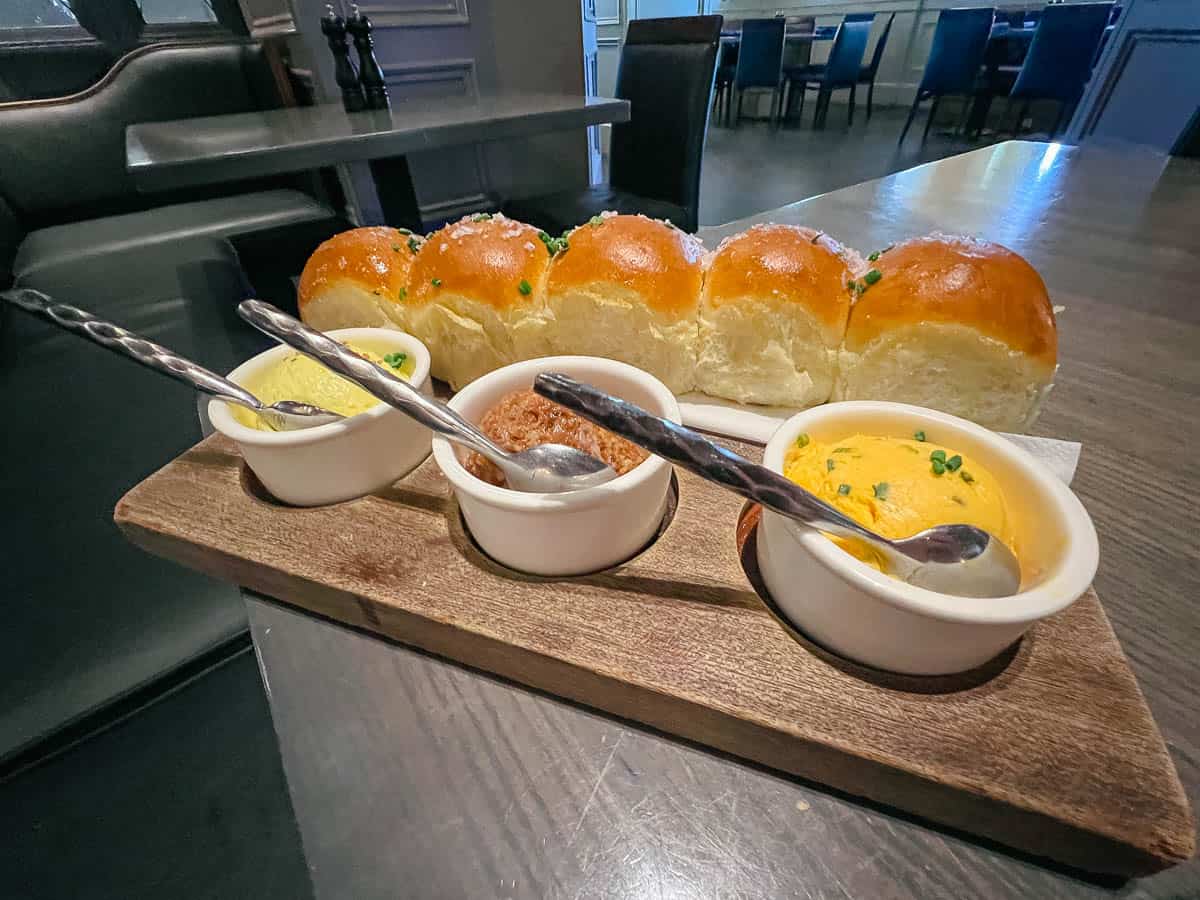 the three spreads that come with the roll appetizer at Ale and Compass 