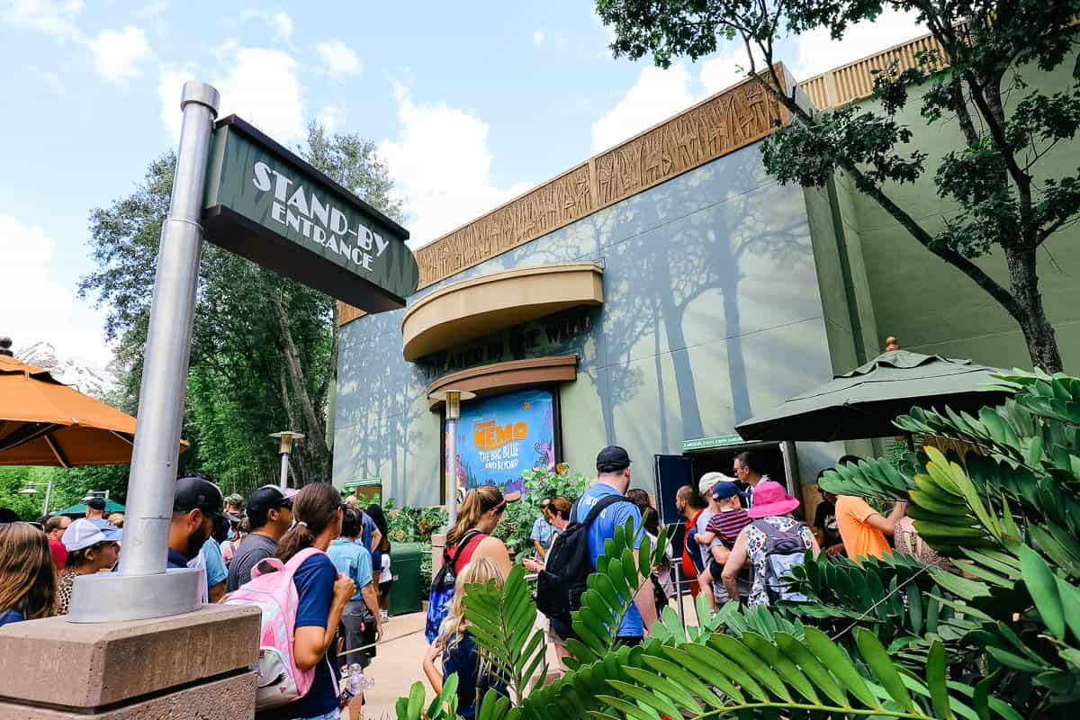 a long line of guests waiting in the Stand-by line for Finding Nemo musical at Animal Kingdom 