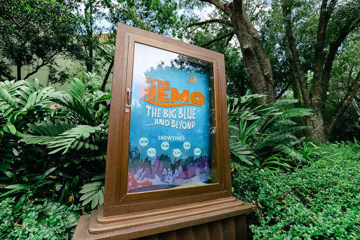 a sign with the showtimes for Finding Nemo The Big Blue and Beyond 