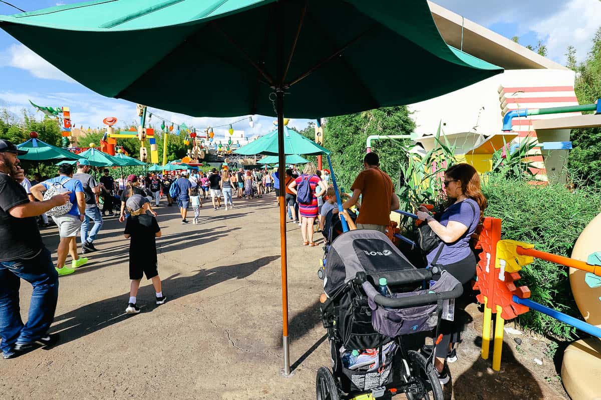 a few spaced out umbrellas as guests wait to meet Woody and Jesse 