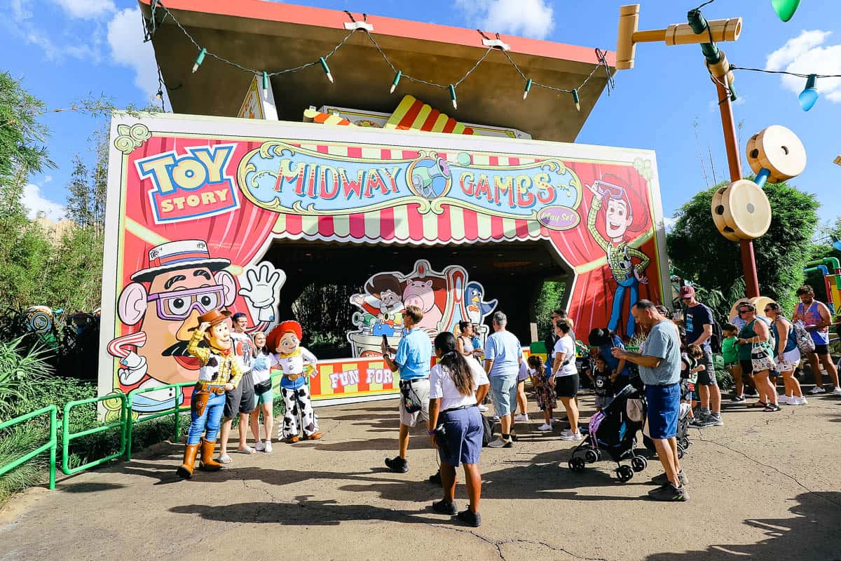 Woody and Jesse meeting a large group of guests in front of Toy Story Mania at Disney's Hollywood Studios.