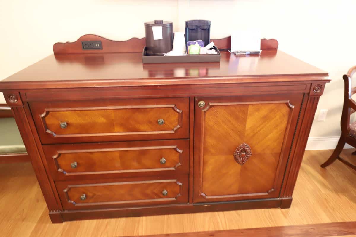 a dresser with a cabinet and drawer space 