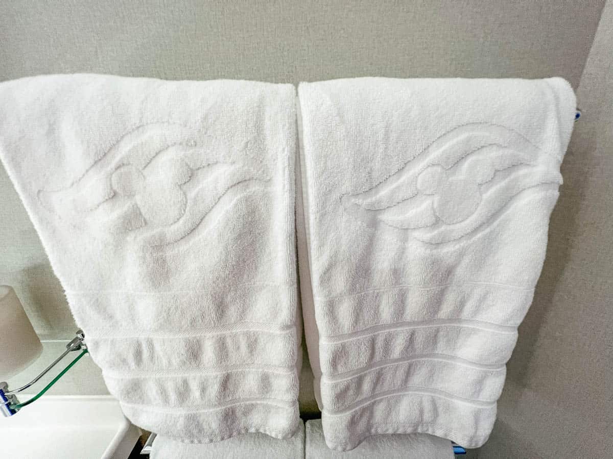 bath towels with Mickey Mouse shapes on them in the Disney Wish bathroom 