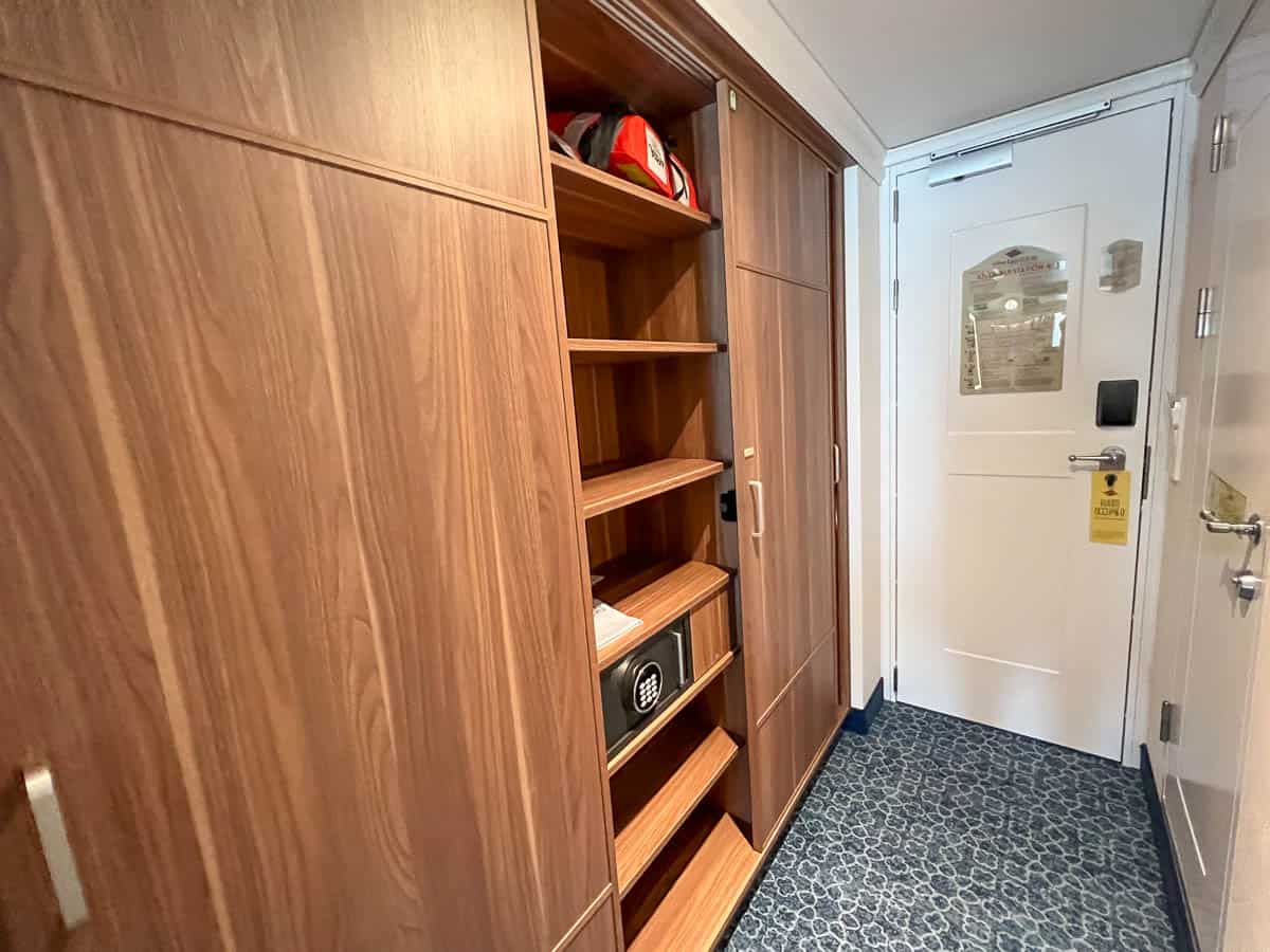 closet shelves and an in room safe in the Disney Wish stateroom 