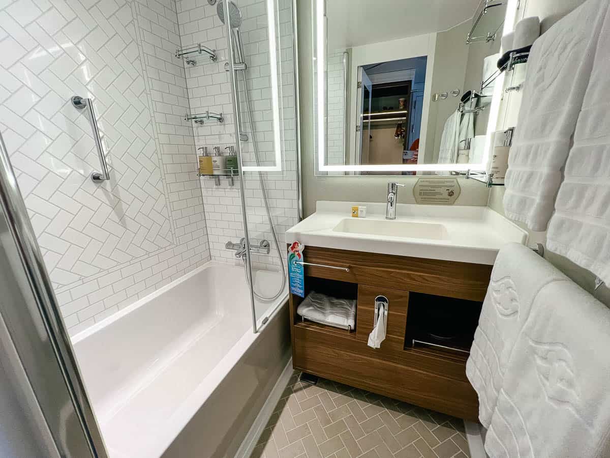 the full size shower and bath are in an oceanview stateroom on the Disney Wish 