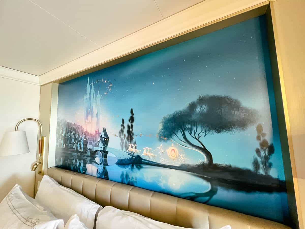 the headboard above our bed with Cinderella scene on the Disney Wish 
