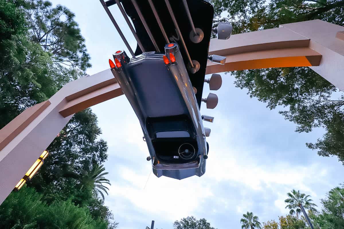 an upside down car at the Rock 'n' Roller Coaster's entrance