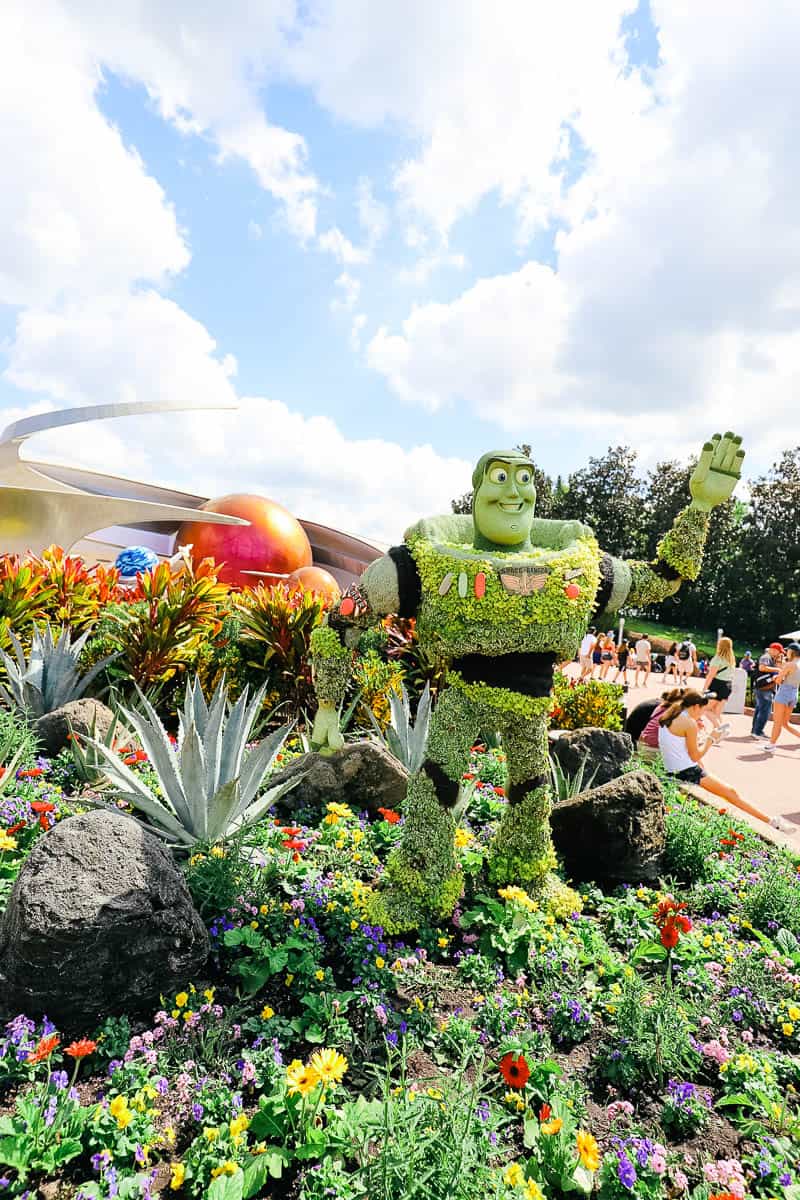 Buzz Lightyear topiary in front of Mission: Space 