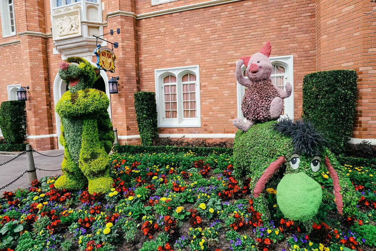 Tigger, Eeyore, and a pink Piglet in topiary form at Epcot 