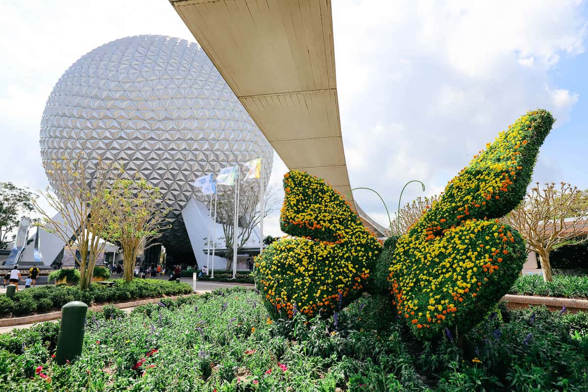 a butterfly to the right of Spaceship Earth 