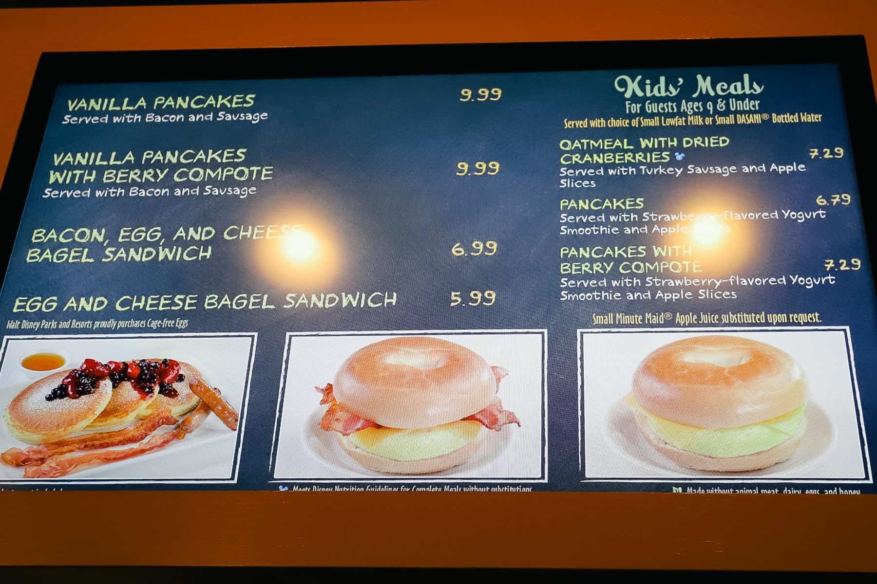 a menu board that lists breakfast items at Riverside Mill like Vanilla Pancakes and bagel sandwiches 