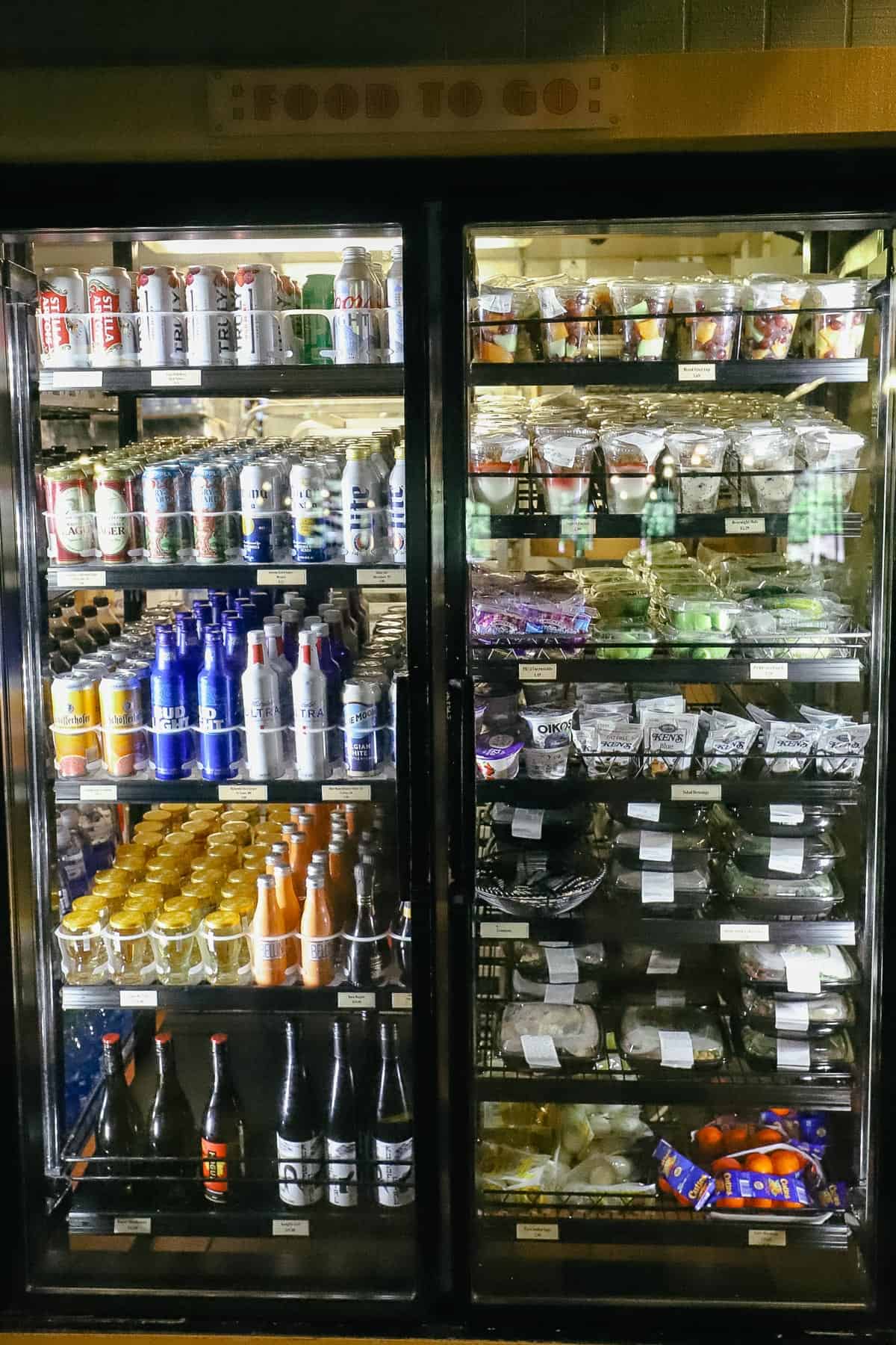 a case with Seltzer, beer, fruit and yogurt 