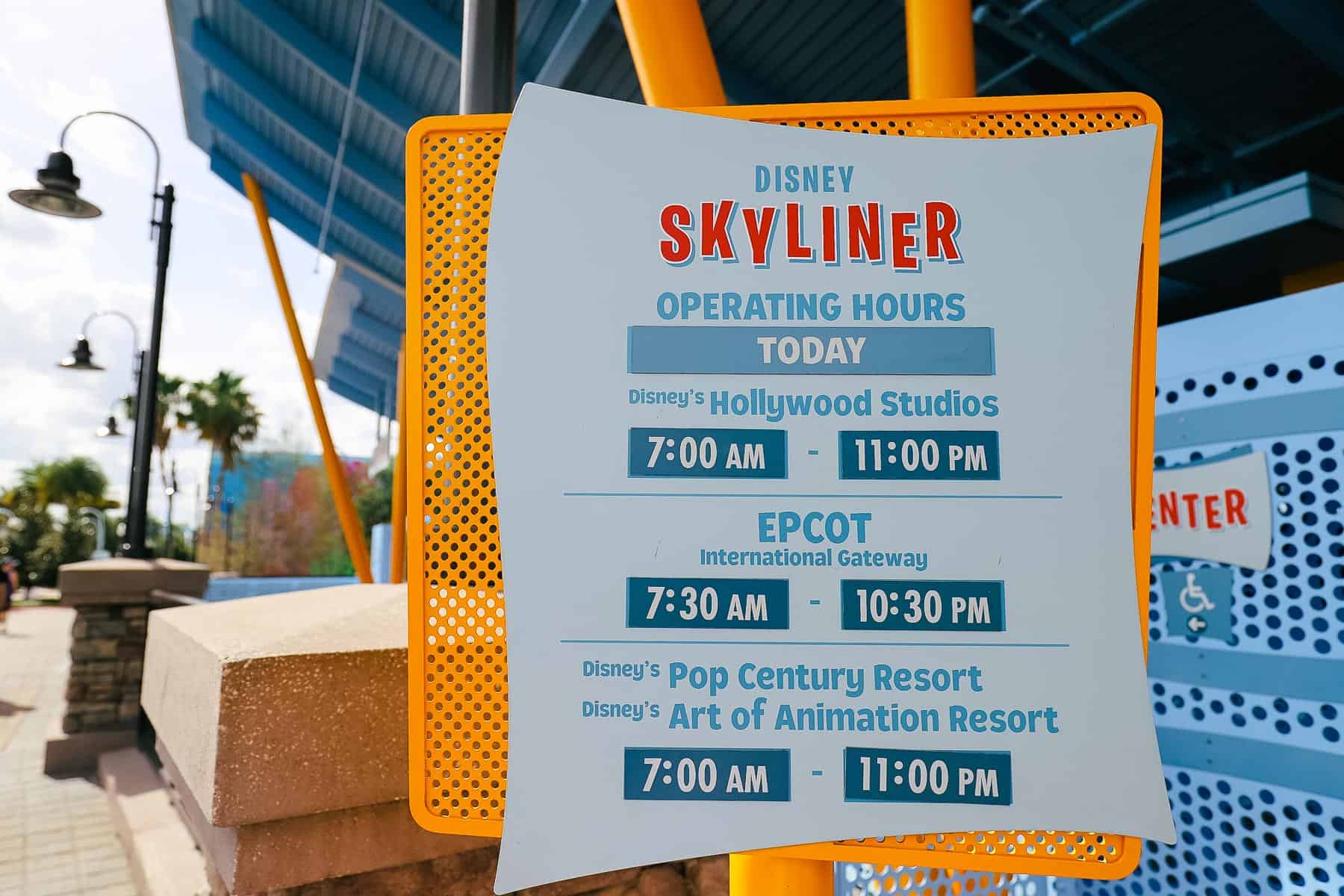 a sign for the Skyliner's hours at Pop Century and Disney's Art of Animation. 