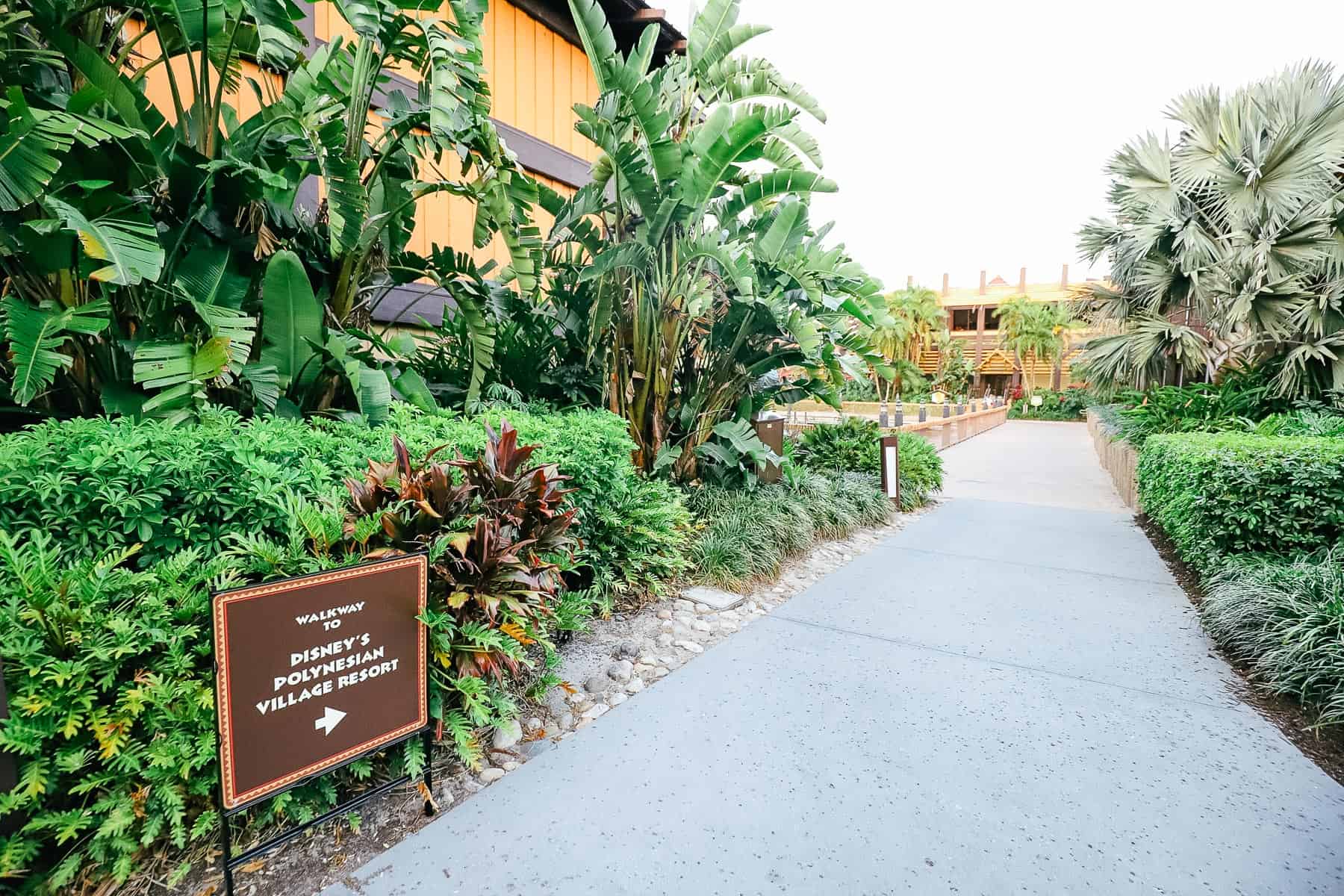 a sign that says walkway to Disney's Polynesian Village Resort 