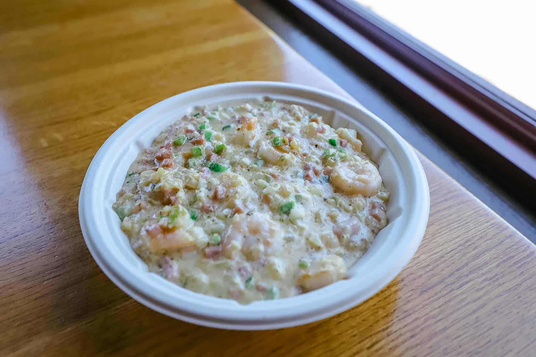 a bowl of shrimp and grits from a restaurant at Port Orleans Riverside 
