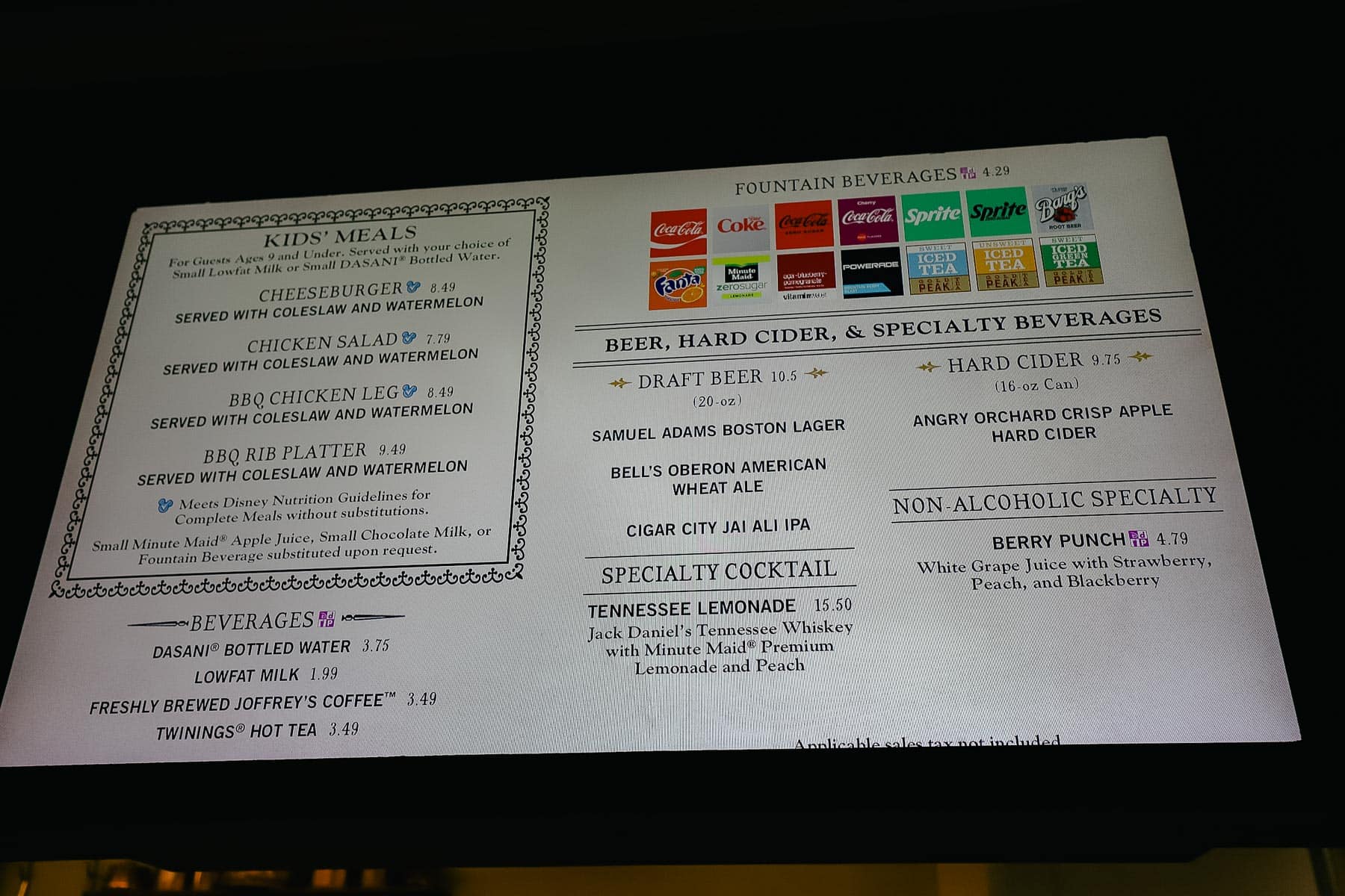 a menu board with sides and drinks 