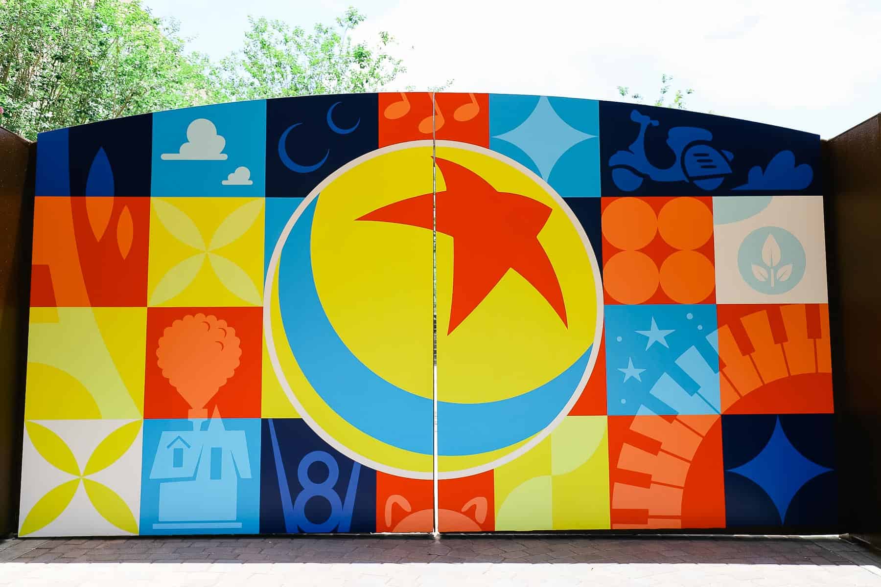 Pixar Gate at Hollywood Studios decorated with Pixar emblems 