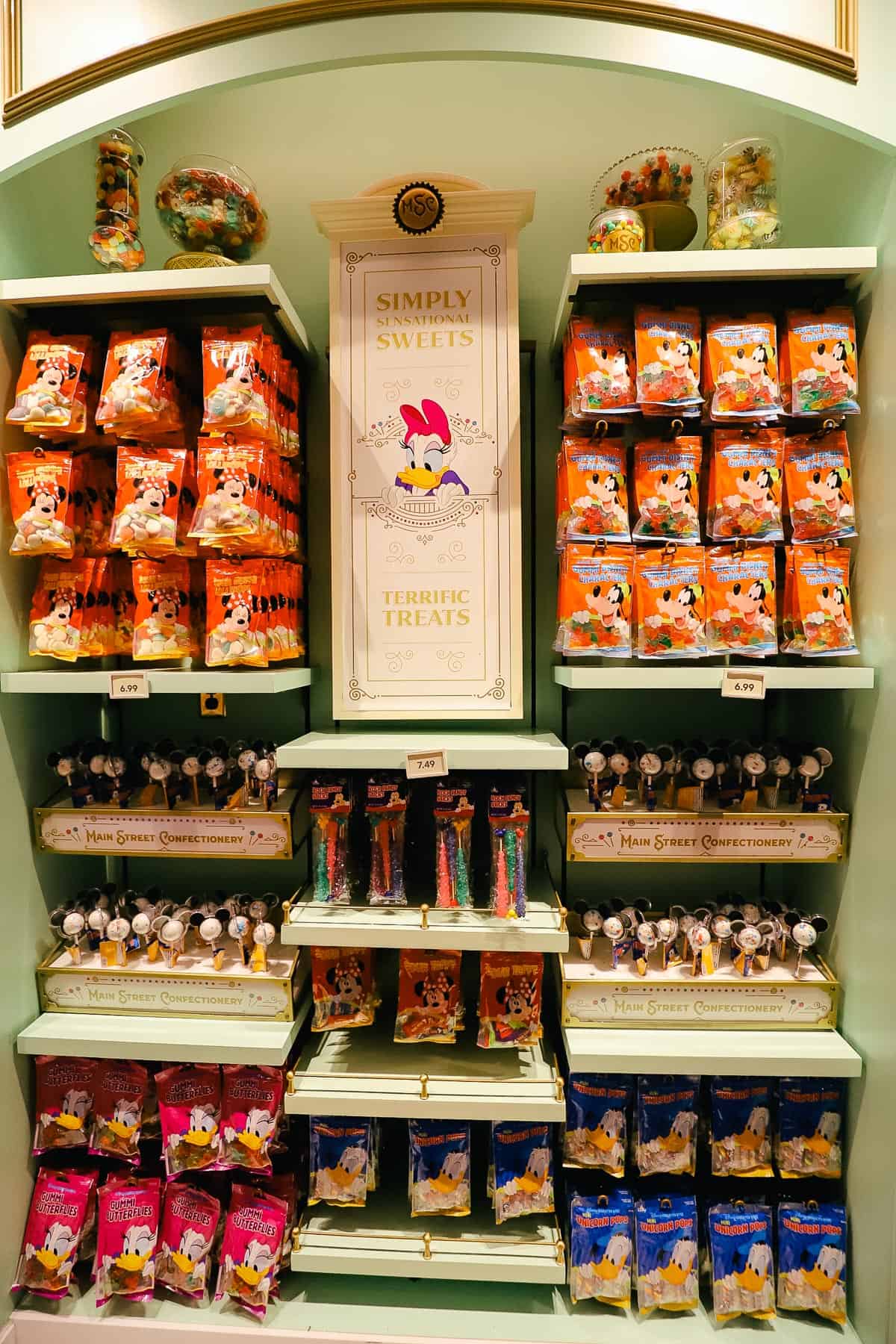 a display with bags of Disney themed candies 