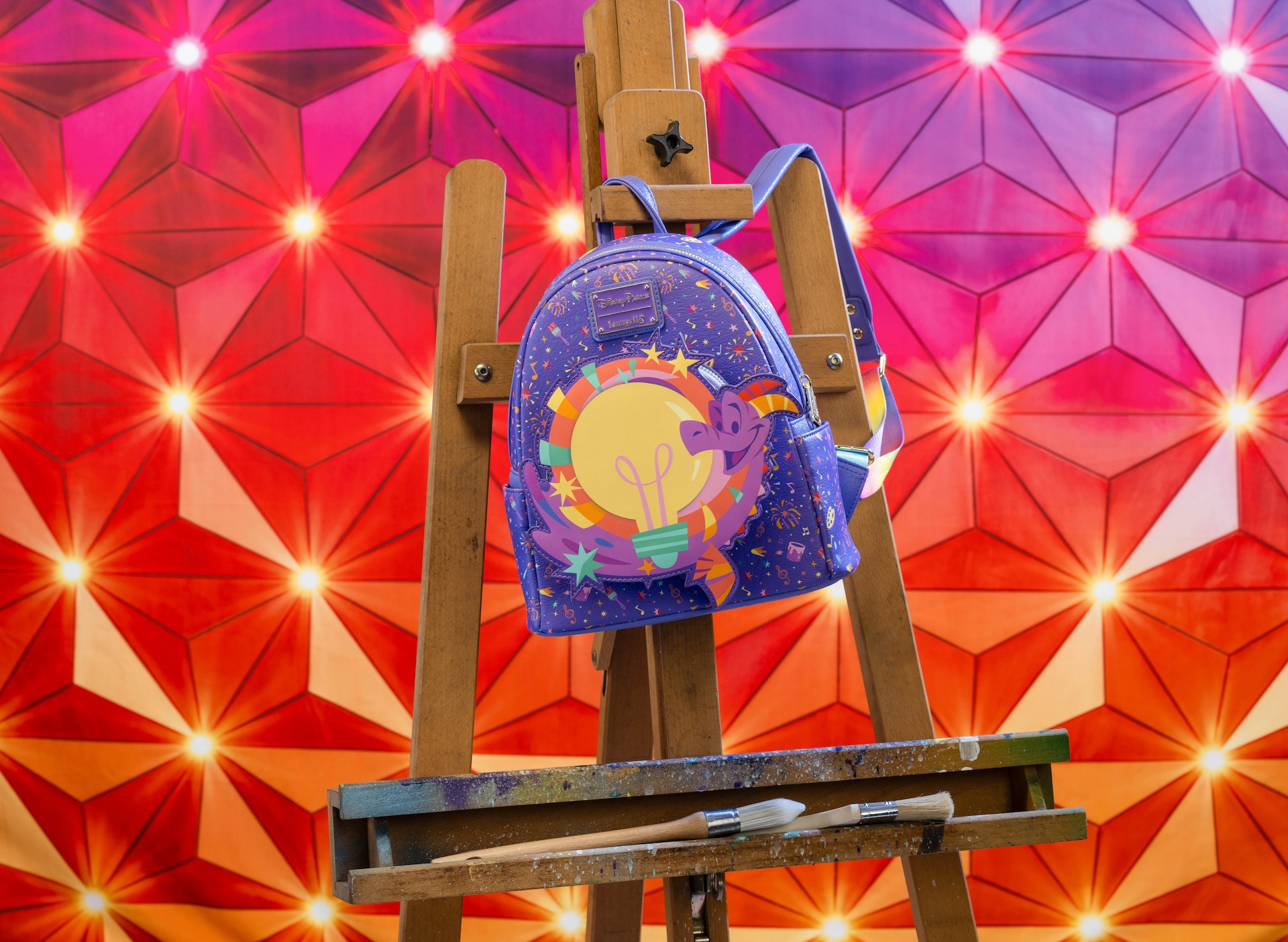 2025 Festival of the Arts Loungefly Backpack in purple with Figment and a lightbulb 