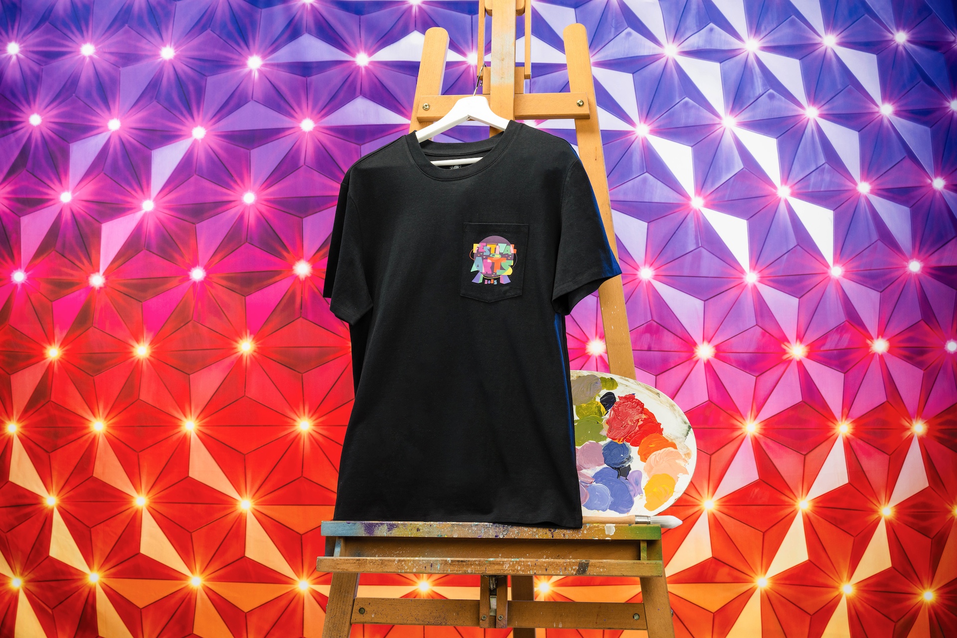 2025 Festival of the Arts black T-shirt with pocket festival logo 