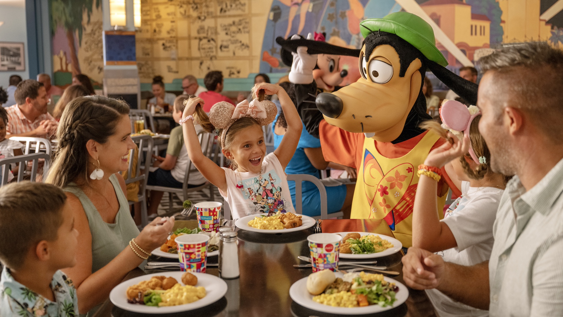 Disney announcement image for free dining plan offer with Goofy and guests