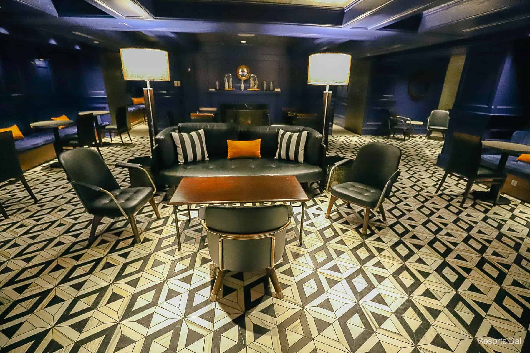 overall design of Ale and Compass Lounge with blue panel walls, coffered ceiling, marble floors 