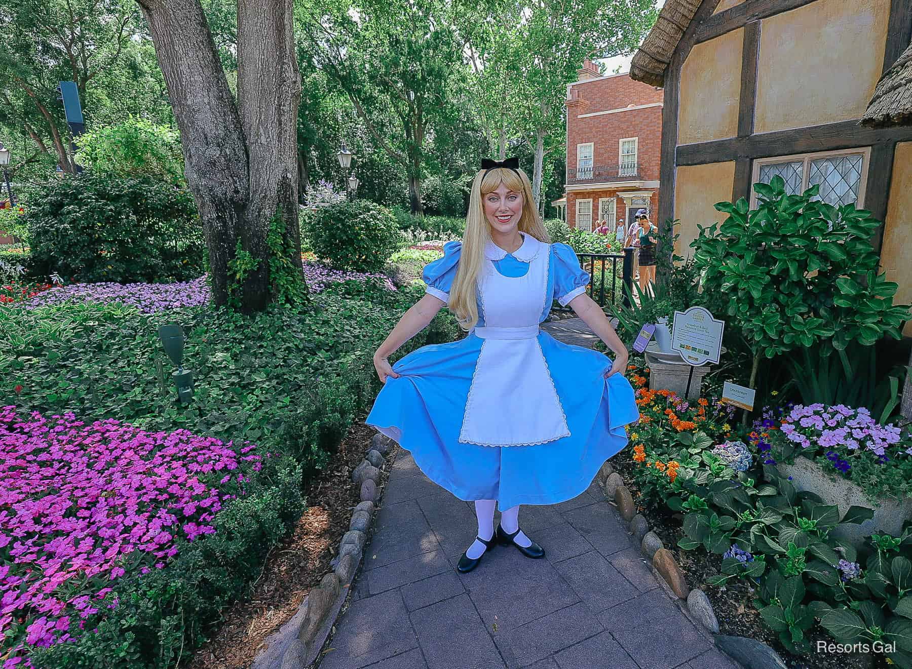 Alice curtsies for a photo at Epcot 